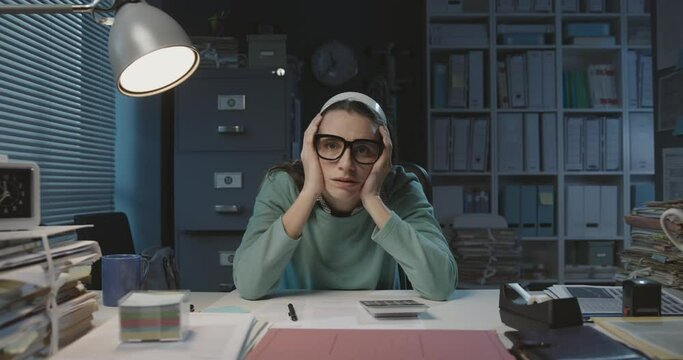 Exhausted stressed employee working overtime