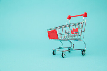 Shopping Trolley on blue background. Online shopping. Sale. Buying and selling concept