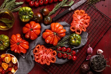 Ox heart tomatoes, on rustic wood background