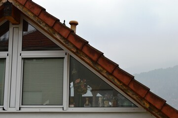 a window in the attic of the house