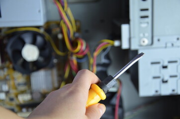 close-up on the hands of the technician repairing a computer