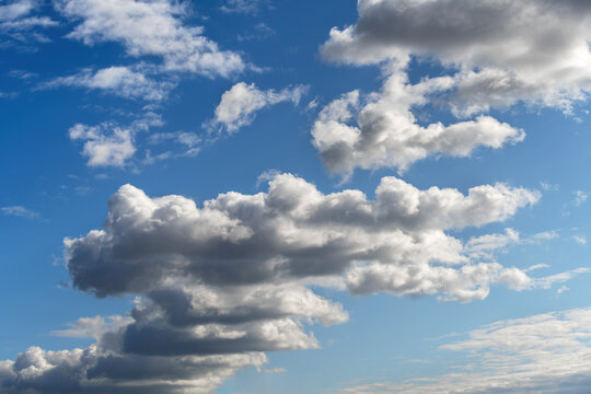 Dramatic clouds on a blue sky background