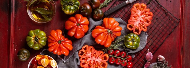 Ox heart tomatoes, on rustic wood background