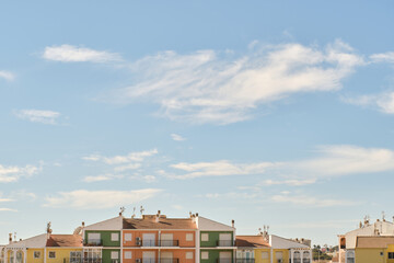 Exterior of residential building against cloudy sky background
