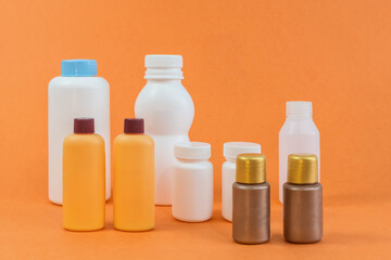 Set of plastic bottles on orange background. Recycling concept and environment.