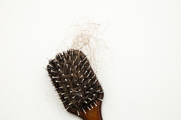 Hair fall because of lack of nourishment and health issues. Hair loss concept.