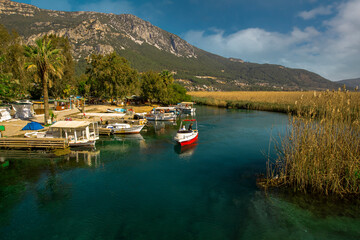 (Muğla - Turkey 05 February 2021) Travel boats in Akyaka, Kadın Azmağı Stream, one of the favorite places of tourism.
