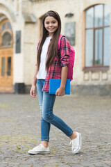 Ready for studies. Happy child carry bag and book in schoolyard. Back to school. September 1. Startup. Non-formal education. September 1. Knowledge day. Schooling years