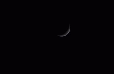Beautiful picture of half moon is isolated on black sky. Selective Focus On Subject