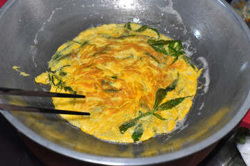 Creamy Omelet with organic Cannabis on pot. Soft focus.2
