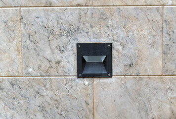 Street lamp in paving slabs