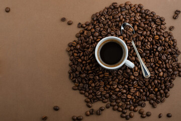 Coffee cup and beans, top view with copyspace for text