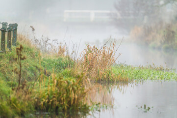 Naklejka na ściany i meble Photo of a river in fog, england