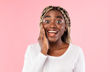 Close up portrait of shocked young black woman