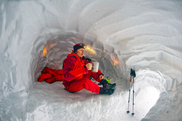 Climber in a snow cave.