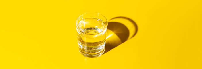 the simple abstract still water with a harsh shadow on the table