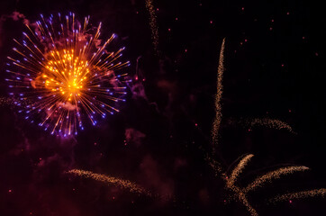 Fototapeta premium festive fireworks in the night black sky