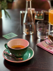 green cup with espresso in a cafe