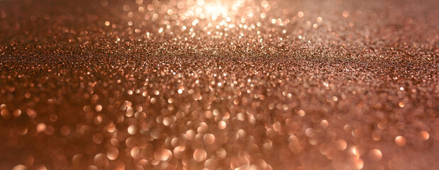 Abstract brown blurred background with fine shiny texture