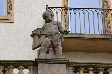 Statue of a boy in an old maternity hospital