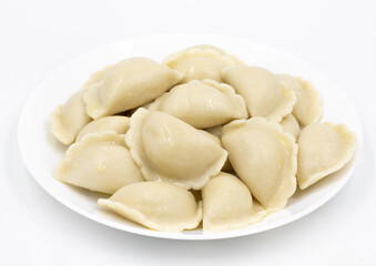 Boiled dumplings with potatoes. Traditional Ukrainian and Russian food. White background.