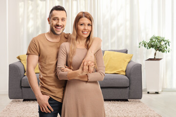 Obraz premium Young couple in embrace standing at home