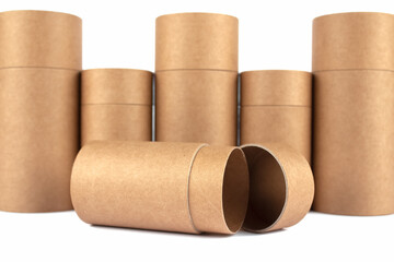 Set of different recyclable paper tubes, cardboard containers with paper caps for cosmetic or other packaging isolated on white background, mockup. Eco-friendly packaging concept. Selective focus