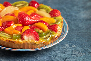 Delicious fresh seasonal fruit tart and cream.