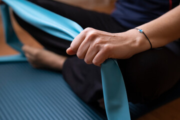 Young woman doing sports with Pilates tire.Doing Pilates and exercise at home.