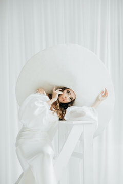 Young Woman In Large Wide Brimmed Hat