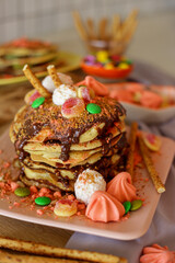 Homemade delicious pancakes with chocolate and sweets