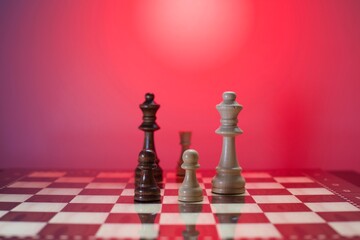chess pieces and glossy chessboard. close up and blurry view