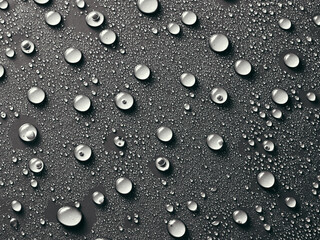 Water drops on grey background.