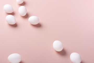Easter white eggs lie on a powdery background, horizontal orientation, copy space