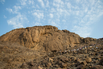 Fototapeta na wymiar Place of first revelation to Prophet Muhammad. Muslim pilgrims climb the Mount of light 