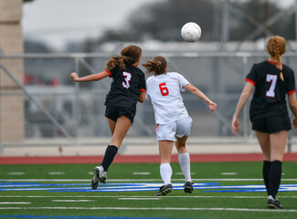 High school girls competing in a soccer match in south Texas