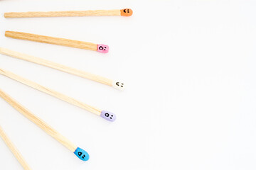 matchsticks with faces painted on the heads
