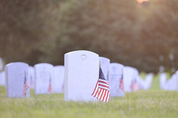 Headstones and National flags in Arlington National Cemetery - Circa Washington D.C. United States of America	 - obrazy, fototapety, plakaty