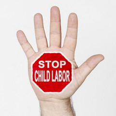 On the palm of the hand there is a stop sign with the inscription - STOP CHILD LABOR