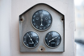 Climate Change symbolised by a vintage weather barometer forecasting change.

