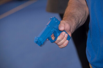 a blue training gun or pistol