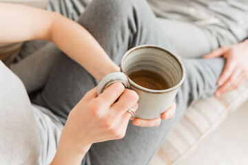 Loving couple with hot drinks