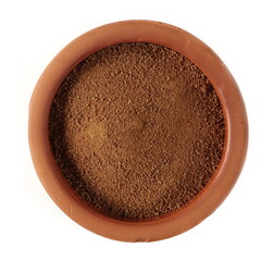 Coconut palm sugar pile in clay pot isolated on white background, top view