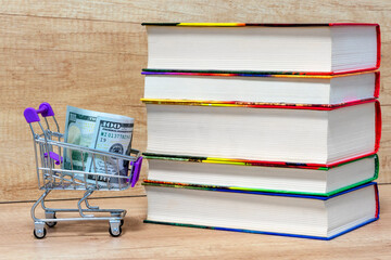 stack of books .Trolley. Concept of book trade, book business, knowledge price
