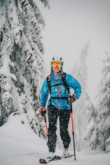 Mountaineer backcountry ski waling two ski alpinist in the mountains. Ski touring in alpine...