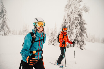 Mountaineer backcountry ski waling two ski alpinist in the mountains. Ski touring in alpine...