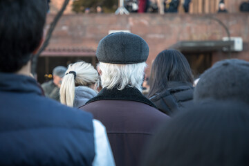 man in white hair in crowd