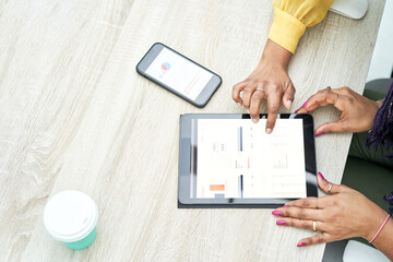 Businesswoman typing on tablet at workplace. Women working in home office hand keyboard