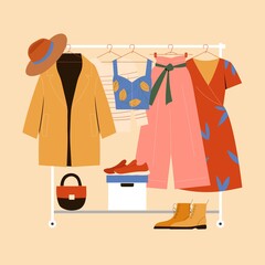 Clothes hanger, garment rack, showroom and clothing organization concept. Clothes, hangers, shoes, bags.