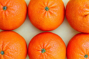 Background of six bright ripe tangerines